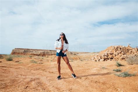 Portrait Of Beautiful Tanned Brunette Woman Outdoors Stock Photo