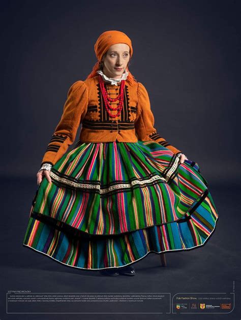 a woman in a colorful dress and orange headdress poses for a magazine cover