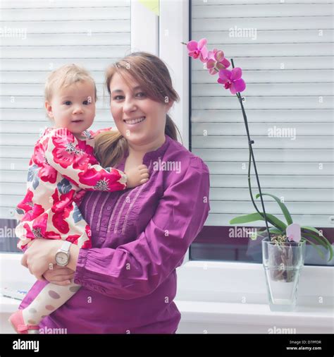 Portrait Of Happy Mother And Baby At Home Stock Photo Alamy