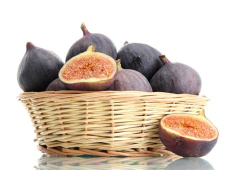 Premium Photo Ripe Sweet Figs In Basket Isolated On White