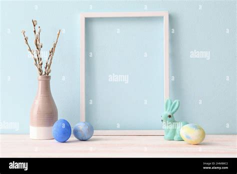 Composition With Photo Frame Easter Eggs Bunny And Pussy Willow
