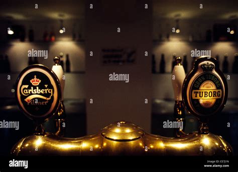 Beer Taps Displays Logo Of The Carlsberg And Tuborg Beer In The Bar