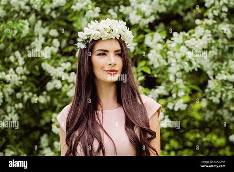 Fashion Portrait Of Beautiful Brunette Fashion Model Woman On Flowers