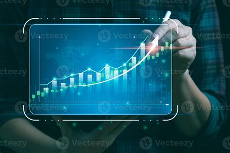 Businessman Holding Tablet And Showing Hologram Graph And Stock Market