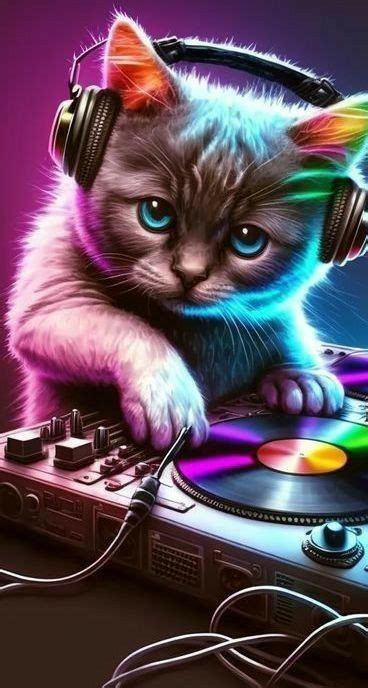 a cat with headphones is sitting on top of a dj's turntable