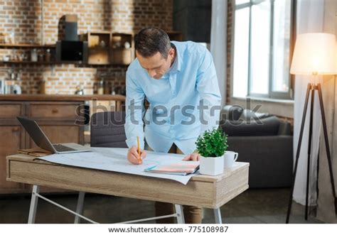 Making Draw Attentive Brunette Bowing Head Stock Photo