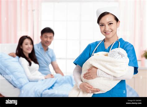 Nurse Holding Baby Hi Res Stock Photography And Images Alamy
