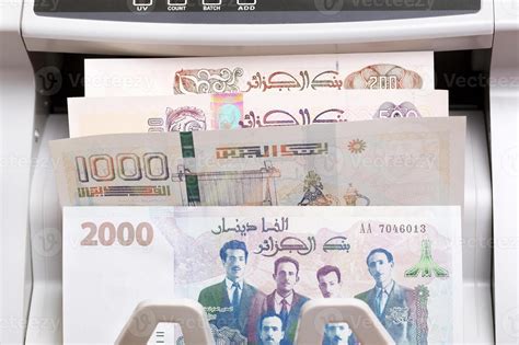 Algerian Dinar In A Counting Machine Stock Photo At Vecteezy