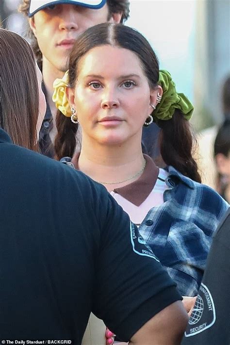 Lana Del Rey Cuts A Casual Figure In A Blue Cropped Flannel As She