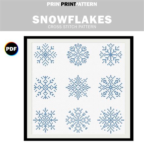 The Snowflakes Cross Stitch Pattern Is Shown In Blue And White With