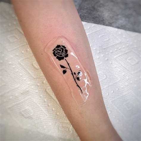 Black Rose Tattoo On The Forearm