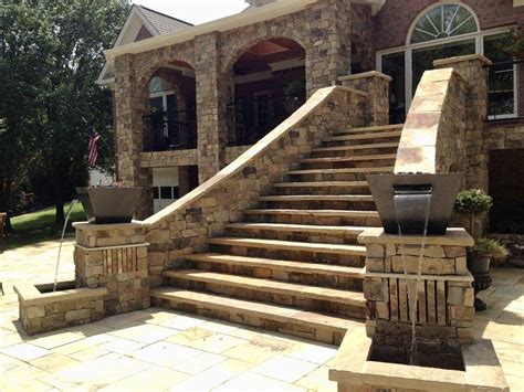 This Custom Designed Grand Staircase Entrance Of Natural Stone Is A