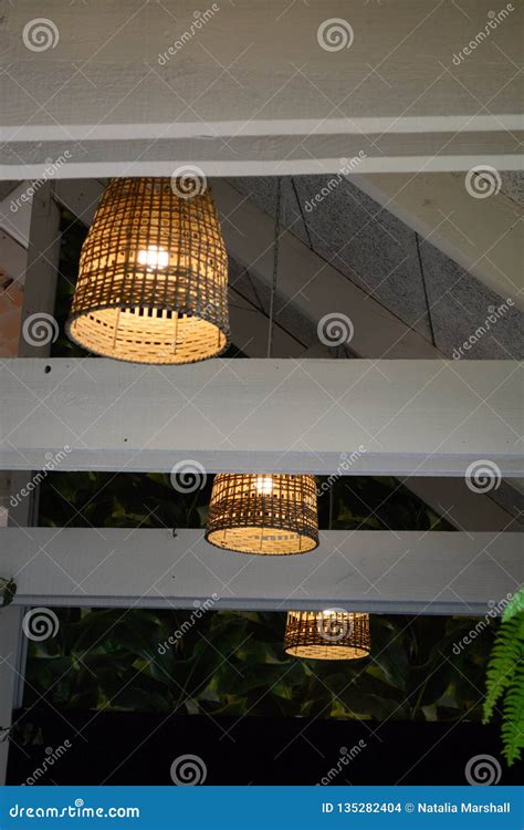 Interior Of A Lovely Old Fashioned Restaurant With Lamps Hanging From