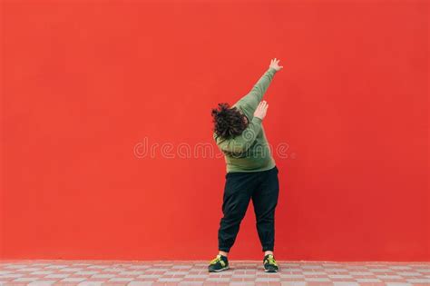 Positive Fat Dancer In Casual Clothes Shows A Performance On The Street