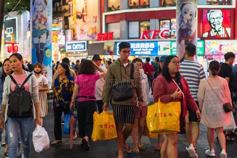 Crowd Of People Walking And Shopping At Ximending Street Market At