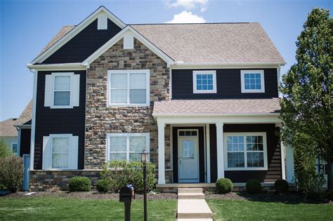 Modern Exterior House Painting Upgrade: Dark Gray Siding with White Trim