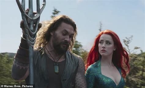 Amber Heard looks fresh as a daisy without a hint of make-up as she ...
