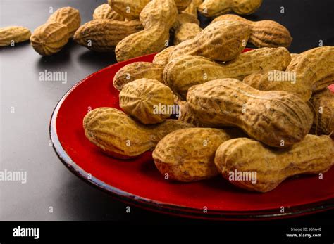 Peanuts Arachis Hypogaea In Shell On Dark Background Close Up