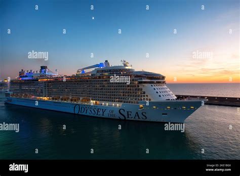 Odyssey of the Seas Cruise Ship leaving port during colorful sunset ...
