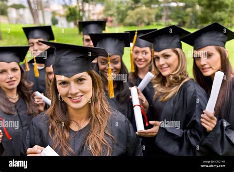 Smiling Group Of Female Graduates With Gown Hi Res Stock Photography