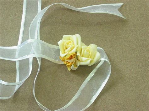 Matching Corsages With Yellow Roses And White Flowers For Weddings