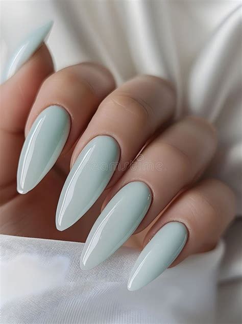 Closeup Of Pastel Sage Green Nail Polish On Almond Shaped Nails