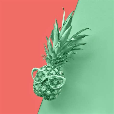Premium Photo Funny Pineapple In Heart Shaped Glasses On Split Paper