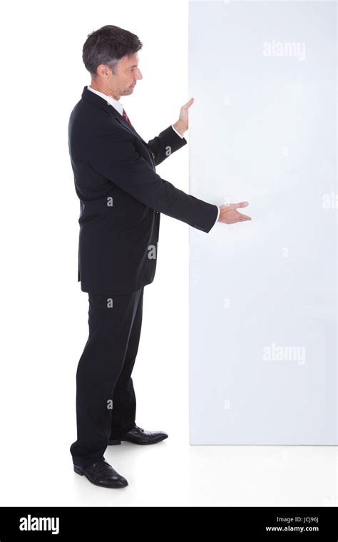 Portrait Of Mature Businessman Presenting Blank Placard Stock Photo Alamy