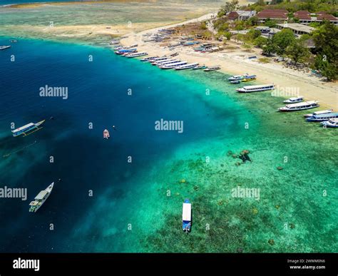 Lines Of Traditional Wooden Boats On The Beach Of A Small Tropical