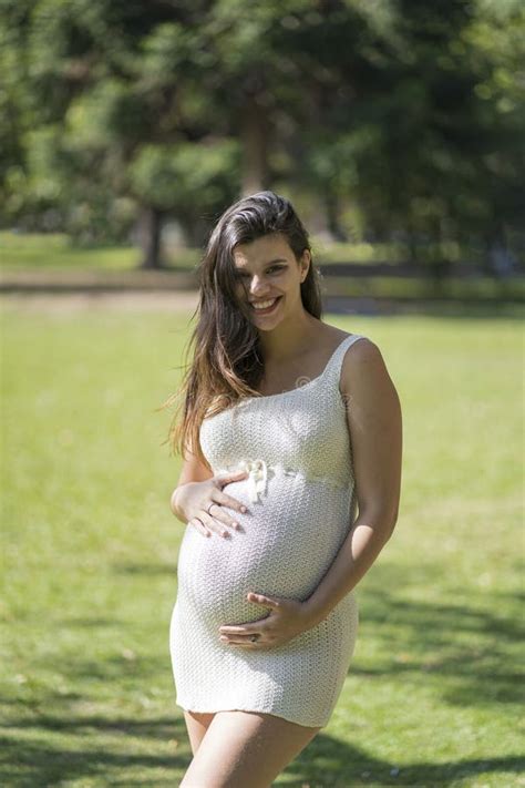 Portrait Of Pregnant Latina Woman In A Park Stock Photo Image Of