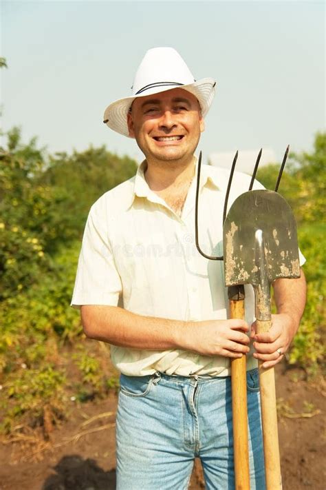 Farmer Holding Pitchfork And Spade Stock Photo Image 16970470