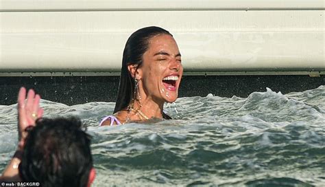Alessandra Ambrosio Dives Into In A Skimpy Purple Bikini As She
