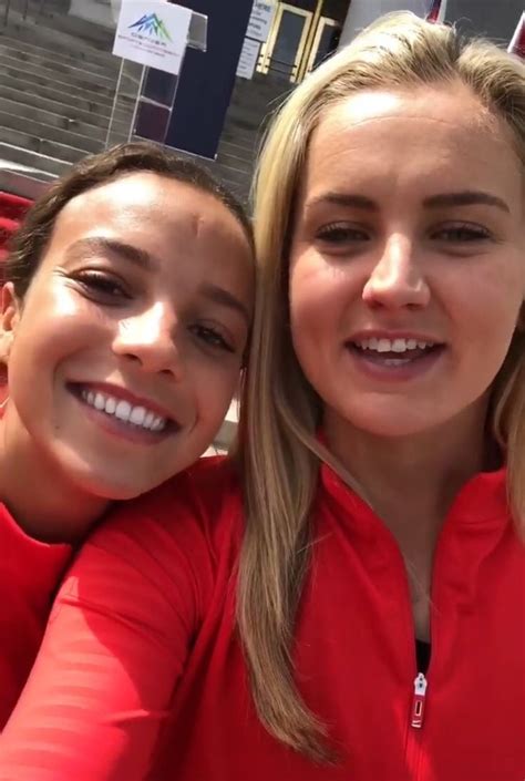 Two Girls Are Posing For The Camera In Front Of Some Bleachers With