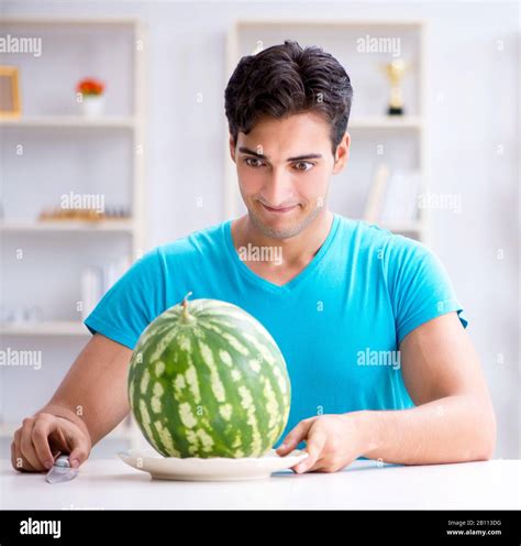 The Man Eating Watermelon At Home Stock Photo Alamy