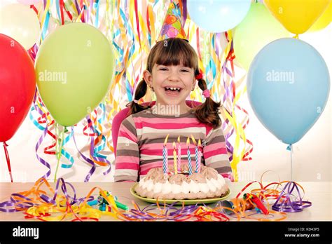 happy little girl with birthday cake and balloons Stock Photo - Alamy