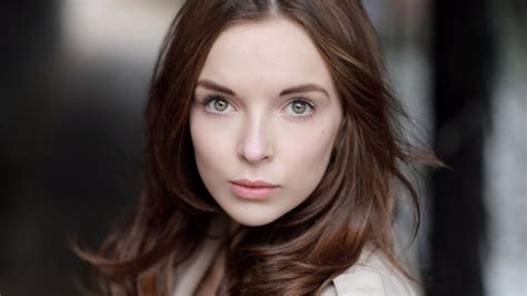 Black Hair Jodie Comer Girl Model Is Standing In Blur Background Wearing White Dress Hd Girls