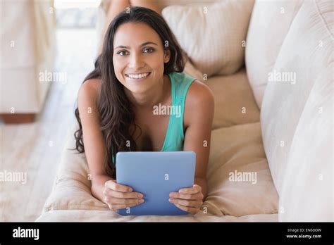 Pretty Brunette Using Her Tablet Pc Stock Photo Alamy