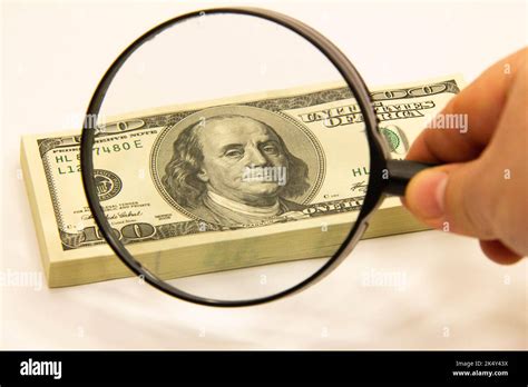 Stack Of Dollars Under A Magnifying Glass Us Dollar Banknotes Are