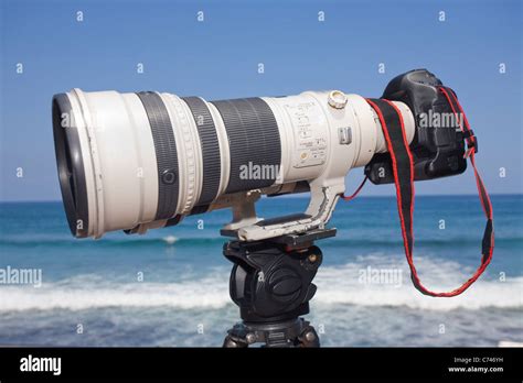 Big Zoom Lens On Dslr Camera And Tripod At A Surf Competition Stock