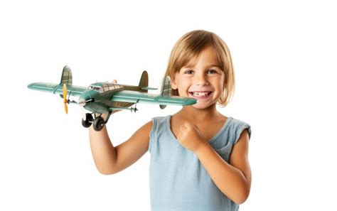 Niña con un avión de juguete Foto Premium