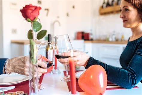 Premium Photo Mature Couple Having A Romantic Dinner At Home For Valentines Day And Doing