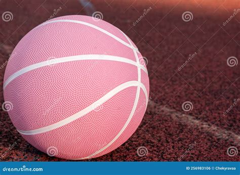 Pink Basketball Ball On The Ground Close Up Ball On The Red Court