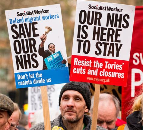 Protester With Placard Banner At The Save Our NHS Protest Demonstration