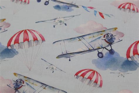 Cotton Fabric With Watercolour Air Planes Clouds And Parachutes By