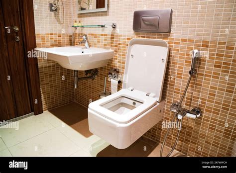 White Modern Ceramic Sinks And Toilet In The Bathroom Stock Photo Alamy