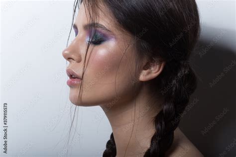 Beautiful Brunette Girl With Braids And Bright Makeup Has Got Closed Eyes Isolated White