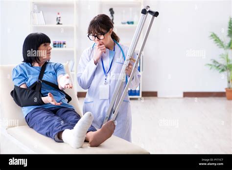 Doctor Examining Old Mature Woman After Incident Stock Photo Alamy