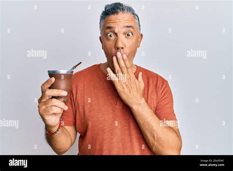 Handsome Middle Age Mature Man Drinking Mate Infusion Covering Mouth