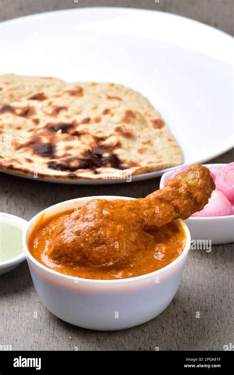 Butter Chciken In Bowl Served With Tandoori Chapati Stock Photo Alamy