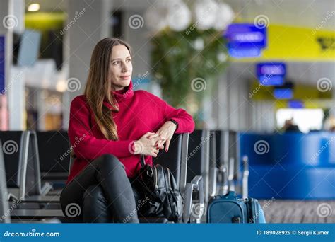 Young Woman Sitting At Airport Waiting For Flight Stock Image Image